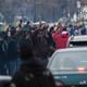 Members of the funeral procession for Jamar Clark join protesters, raising their fists, outside the 4th Precinct police station Nov. 25, 2015, in Minneapolis.
Stephen Maturen/Getty Images